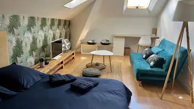 Coin salon dans l'établissement Appartement 3 chambres centre ville Cholet 25min du Puy duFou