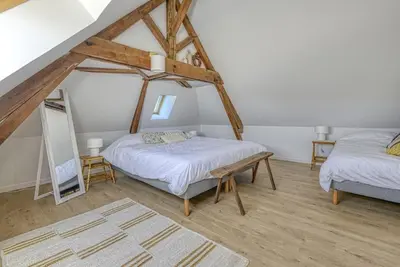 Un ou plusieurs lits dans un hébergement de l'établissement Gîte de l'Etoile, maison rénovée à 18min du PuyduFou