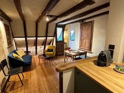 Coin salon dans l'établissement Le Petit Tinténiac - T2 cosy au cœur de la Doutre