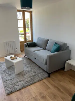 Coin salon dans l'établissement L'appartement des Perroquets