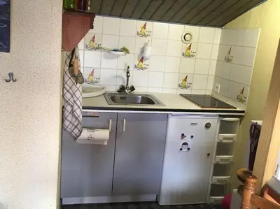 Cuisine ou kitchenette dans l'établissement STUDIO A LA PLAGE 20m Belle vue