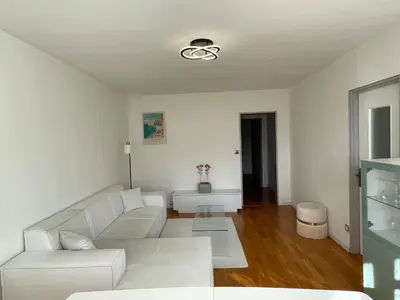 Coin salon dans l'établissement Chambre meublé chez l'habitan