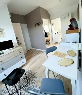 Télévision ou salle de divertissement dans l'établissement Le phare de la cote ouest