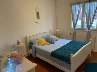 Un ou plusieurs lits dans un hébergement de l'établissement Appart, chantier naval, très cosy et vintage