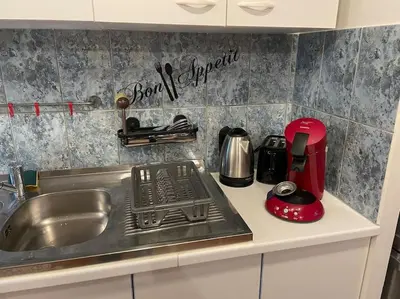 Cuisine ou kitchenette dans l'établissement Appart, chantier naval, très cosy et vintage