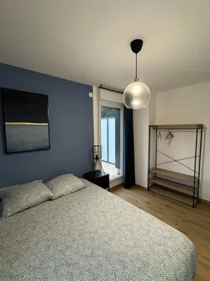 Un ou plusieurs lits dans un hébergement de l'établissement Le Contrie - Bel appartement avec terrasse