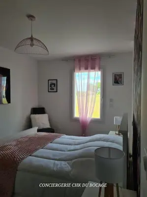 Un ou plusieurs lits dans un hébergement de l'établissement La Môme joli gîte à 15 min du Puy duFou