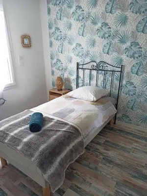 Un ou plusieurs lits dans un hébergement de l'établissement La Môme joli gîte à 15 min du Puy duFou