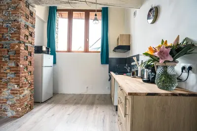 Cuisine ou kitchenette dans l'établissement Maison de ville envoutante, expérience unique !