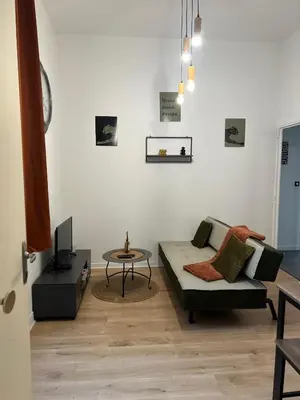 Coin salon dans l'établissement Charmant 2 chambres - Centre