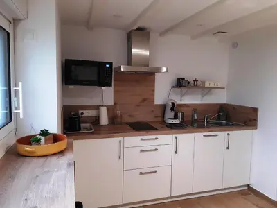 Cuisine ou kitchenette dans l'établissement Grange Rénovée 3 pers-Le GrandLieu-Gîte Le 411