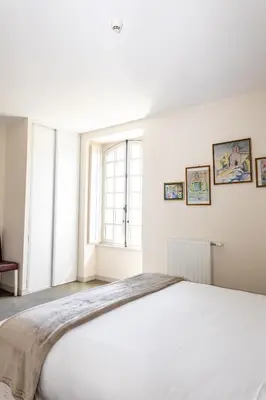 Un ou plusieurs lits dans un hébergement de l'établissement Auberge le Prieuré des Gourmands