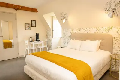 Un ou plusieurs lits dans un hébergement de l'établissement Auberge le Prieuré des Gourmands