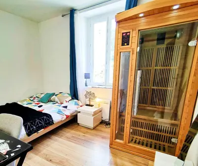 Un ou plusieurs lits dans un hébergement de l'établissement 2 chambres Centre Chateaubriant Sauna