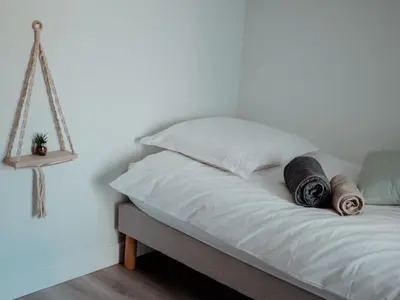 Un ou plusieurs lits dans un hébergement de l'établissement Gîte 4 chambres avec bien-être et terrasses au cœur du Marais Breton - FR-1-426-559