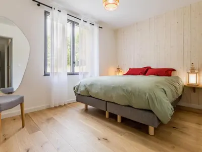Un ou plusieurs lits dans un hébergement de l'établissement Ancien corps de ferme rénové avec jardin, terrasse et recharge EV, à 24 km de Nantes - FR-1-306-1282