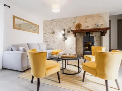 Coin salon dans l'établissement Ancien corps de ferme rénové avec jardin, terrasse et recharge EV, à 24 km de Nantes - FR-1-306-1282