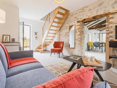 Coin salon dans l'établissement Ancien corps de ferme rénové avec jardin, proche de Nantes, wifi, borne de recharge et animaux acceptés. - FR-1-306-1280