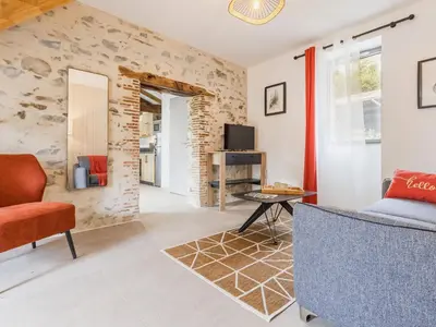 Coin salon dans l'établissement Ancien corps de ferme rénové avec jardin, proche de Nantes, wifi, borne de recharge et animaux acceptés. - FR-1-306-1280