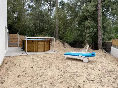 Jardin de l'établissement Gîte climatisé DUNE ET PLAGE jqà 12 personnes