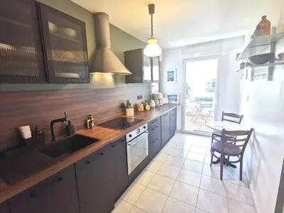 Cuisine ou kitchenette dans l'établissement Sérénité - Proche Parc des Expositions