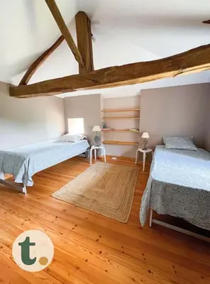 Un ou plusieurs lits dans un hébergement de l'établissement Tranquiloue - Maison de charme à la campagne - PuyduFou