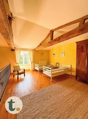 Un ou plusieurs lits dans un hébergement de l'établissement Tranquiloue - Maison de charme à la campagne - PuyduFou