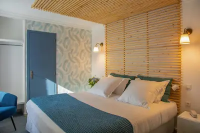 Un ou plusieurs lits dans un hébergement de l'établissement Hôtel Sedrez