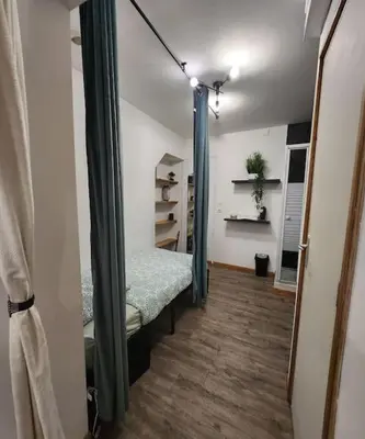 Un ou plusieurs lits dans un hébergement de l'établissement La petite loge de l'ile