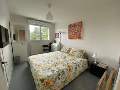 Un ou plusieurs lits dans un hébergement de l'établissement Bed and Breakfast Nantes au calme proche aéroport, gare et centre-ville