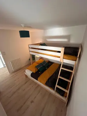 Un ou plusieurs lits dans un hébergement de l'établissement Maison du Colombier