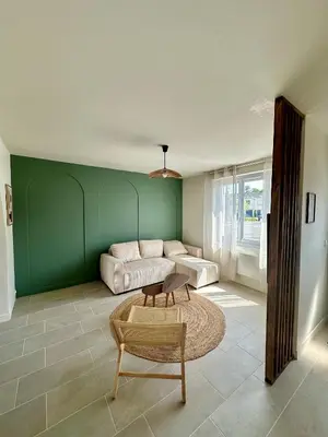 Coin salon dans l'établissement Charmante Maison avec Terrasse