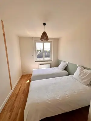 Un ou plusieurs lits dans un hébergement de l'établissement Charmante Maison avec Terrasse