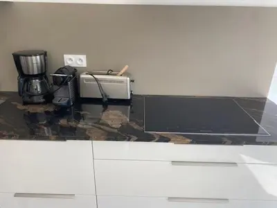 Cuisine ou kitchenette dans l'établissement SixTer