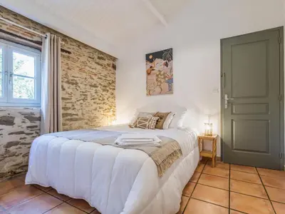 Un ou plusieurs lits dans un hébergement de l'établissement Maison avec piscine privée chauffée, proche plage à Pornic - FR-1-306-1284