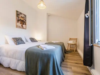 Un ou plusieurs lits dans un hébergement de l'établissement Maison avec piscine privée chauffée, proche plage à Pornic - FR-1-306-1284