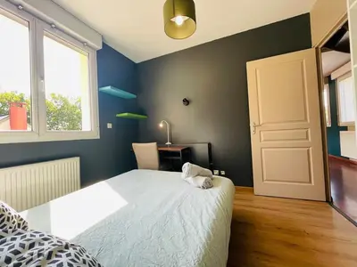 Un ou plusieurs lits dans un hébergement de l'établissement Casa Belle Rive