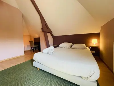 Un ou plusieurs lits dans un hébergement de l'établissement Casa Belle Rive