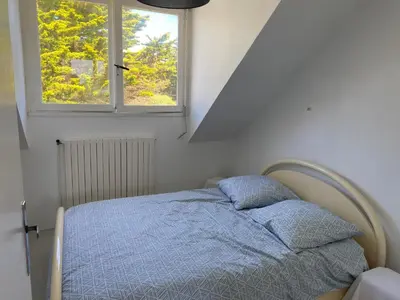 Un ou plusieurs lits dans un hébergement de l'établissement Maison face mer !