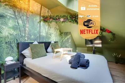Un ou plusieurs lits dans un hébergement de l'établissement La Suite Jungle - l'expérience immersive
