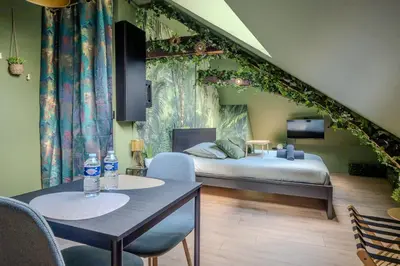 Un ou plusieurs lits dans un hébergement de l'établissement La Suite Jungle - l'expérience immersive
