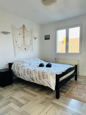 Un ou plusieurs lits dans un hébergement de l'établissement Appartement Escale Paquebot Confort et Élégance