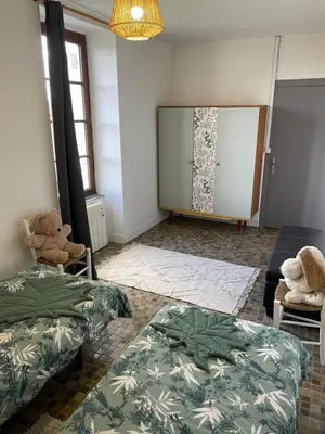 Un ou plusieurs lits dans un hébergement de l'établissement Gîte en bord de lac