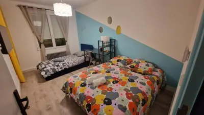 Un ou plusieurs lits dans un hébergement de l'établissement La maison ocre - chambre turquoise