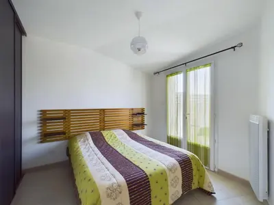 Un ou plusieurs lits dans un hébergement de l'établissement Maison pour 4 entre plages et marais salants
