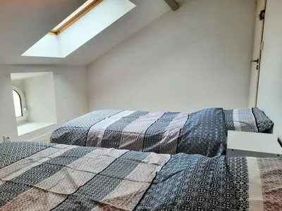 Un ou plusieurs lits dans un hébergement de l'établissement Élégante Maison de ville