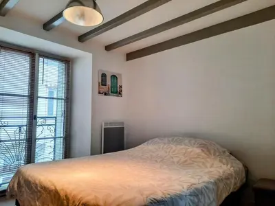 Un ou plusieurs lits dans un hébergement de l'établissement Élégante Maison de ville