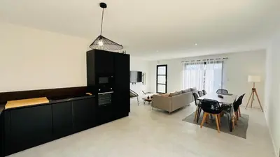 Coin salon dans l'établissement La Tonka, maison neuve proche océan