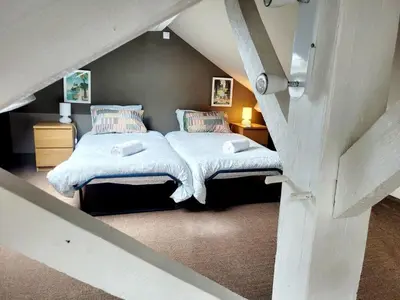 Un ou plusieurs lits dans un hébergement de l'établissement La maison de Jade
