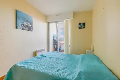 Un ou plusieurs lits dans un hébergement de l'établissement Vue sur la Plage des Demoiselles - Appt vue mer